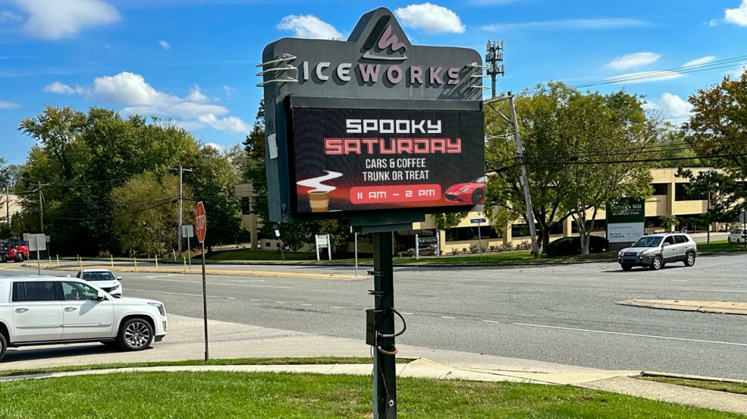 IceWorks Skating Complex LED sign showing a scheduled full-colour ad